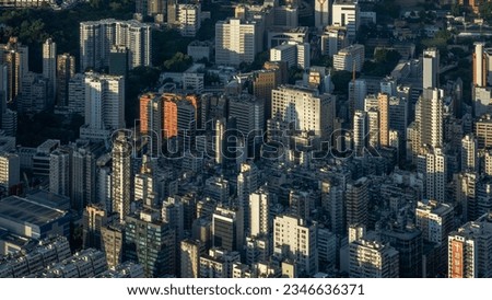 Aerial view of Hong Kong's central residential housing and commercial area at sunset time.