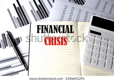 FINANCIAL CRISIS text written on notebook on chart and diagram