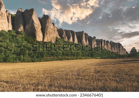 Scenic view with sharp dragon teeth rocks at the sunset. Penitent rocks in Provence, France Royalty-Free Stock Photo #2346676401