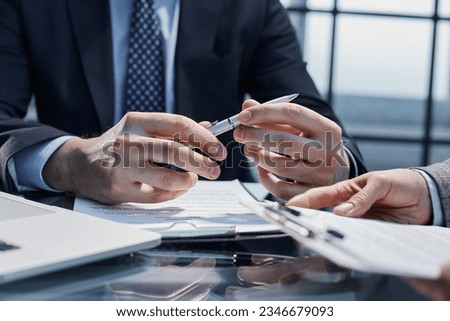 The concept of signing documents and hiring employees.