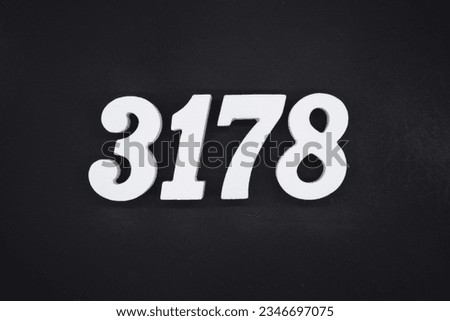 Black for the background. The number 3178 is made of white painted wood.