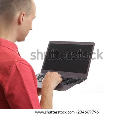 rear view of a casual man with laptop computer