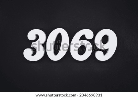 Black for the background. The number 3069 is made of white painted wood.