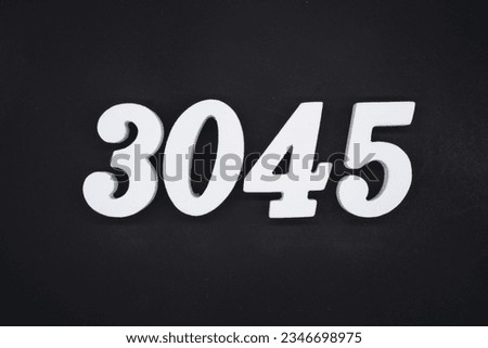 Black for the background. The number 3045 is made of white painted wood.