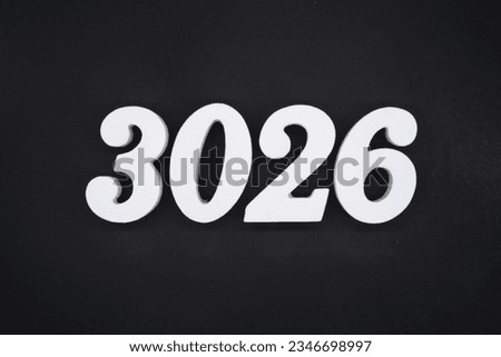 Black for the background. The number 3026 is made of white painted wood.