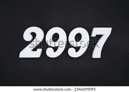 Black for the background. The number 2997 is made of white painted wood.