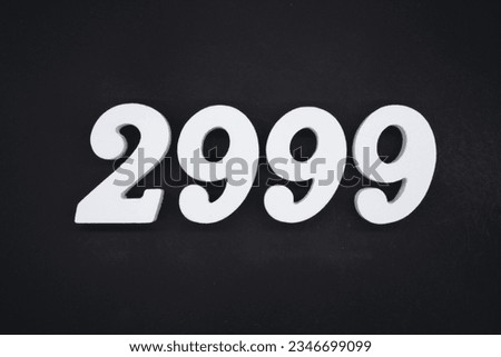 Black for the background. The number 2999 is made of white painted wood.