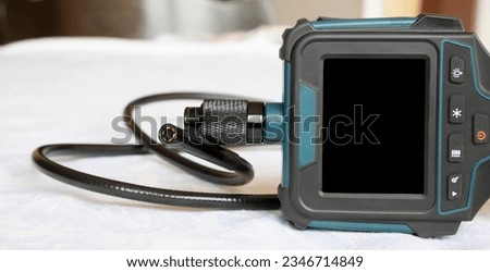 Endoscope camera on the table. Flexible inspection camera. Banner view Royalty-Free Stock Photo #2346714849