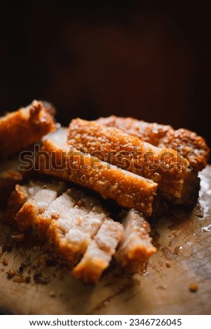 Pork belly crispy on a wooden chopping board