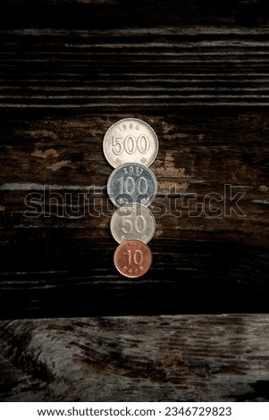 Korean coins placed on a wooden table