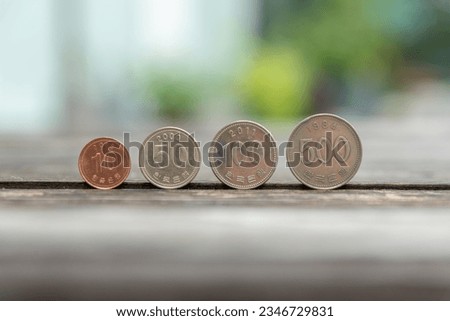 Korean coins placed on a wooden table