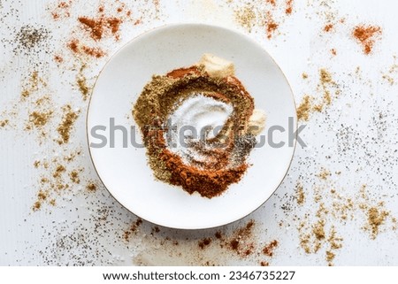 A messy mixture of spices used to make a taco seasoning blend.