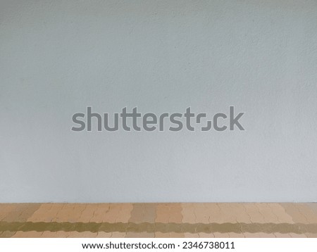 Empty gray wall photo, studio interior, concrete backdrop and cement floor, nice shelf, editing photo montage, product display and text presentation on blank space background.
