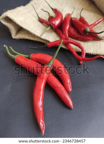It looks like a red chili in the photo. As a spice, hot chilies are very popular in Southeast Asia as a flavor enhancer for food.