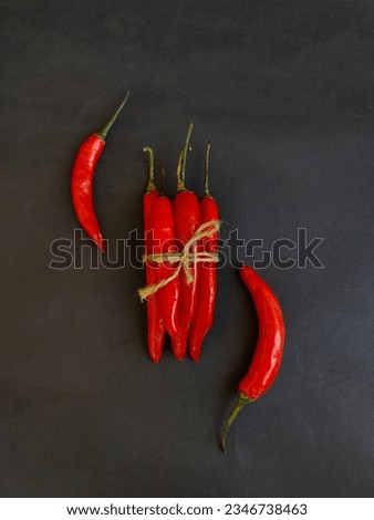 It looks like a red chili in the photo. As a spice, hot chilies are very popular in Southeast Asia as a flavor enhancer for food.
