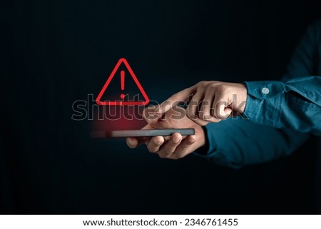 Scammer alert and warning caution signs on mobile phone. cyber attack on online network error system. Cybersecurity vulnerability