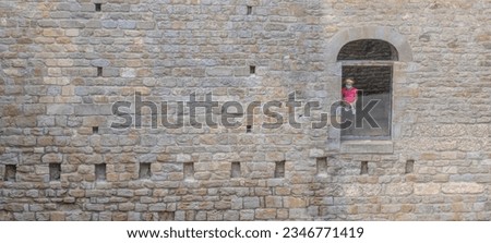 young girl trapped behind glass