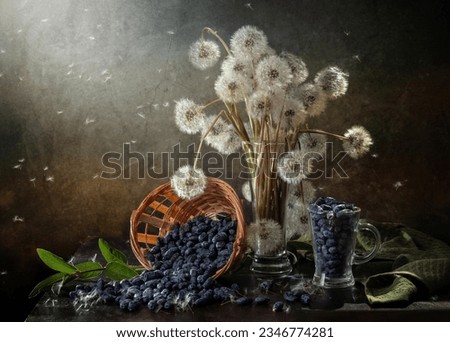 Rustic still life with dandelions and scattered honeysuckle on a dark background.
