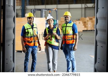 factory workers or engineers talking and looking at inside container in the warehouse storage Royalty-Free Stock Photo #2346779815