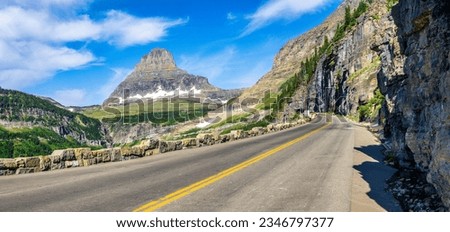 Panoramic view of Going-To-The-Sun road in Glacier National Park, Montana with Clements Mountain and the East Side tunnel in the background Royalty-Free Stock Photo #2346797377