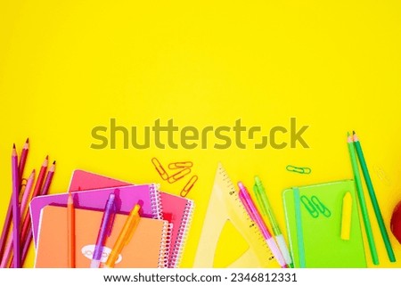 back to school styed blue and yellow scene border with colorful school supplies