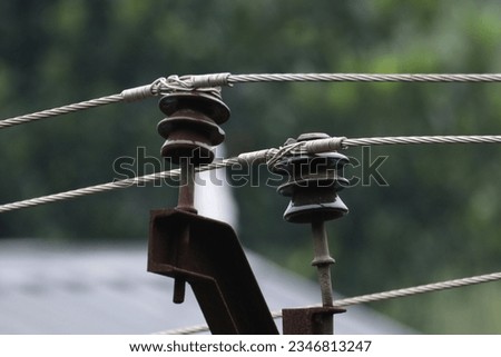 Network of power lines and associated equipment used to transmit and distribute electricity over a geographic area Royalty-Free Stock Photo #2346813247