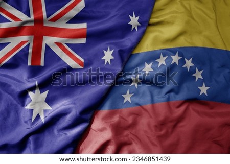 big waving realistic national colorful flag of australia and national flag of venezuela . macro