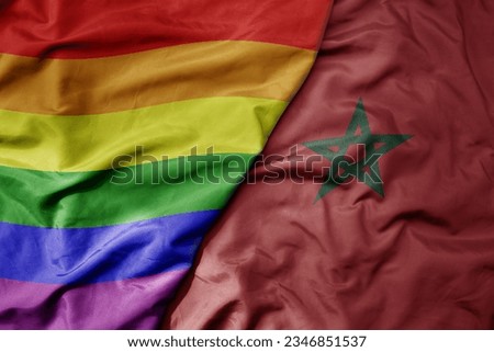 big waving realistic national colorful flag of morocco and rainbow gay pride flag . macro