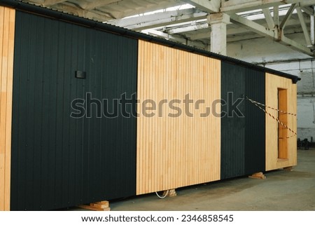 Newly built single storey prefabricated modular building. Prefabricated mobile wooden house at construction site Royalty-Free Stock Photo #2346858545