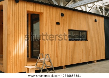 Newly built single storey prefabricated modular building. Prefabricated mobile wooden house at construction site Royalty-Free Stock Photo #2346858561