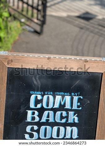 Chalkboard Sign With Words Come Back Soon Visit Restaurant City Urban Street 