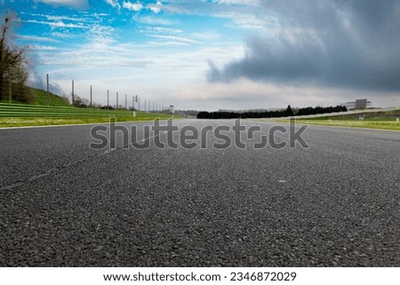 Straight asphalt drive way motor sport circuit landscape Royalty-Free Stock Photo #2346872029