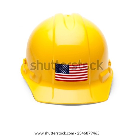Yellow Hardhat with an American Flag Decal on the Front Isolated on White Background. Royalty-Free Stock Photo #2346879465