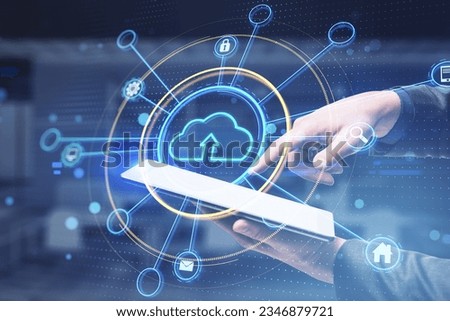 Close up of male hand holding and using mobile phone with glowing cloud computing hologram on blurry office interior background. Data storage and database concept. Double exposure