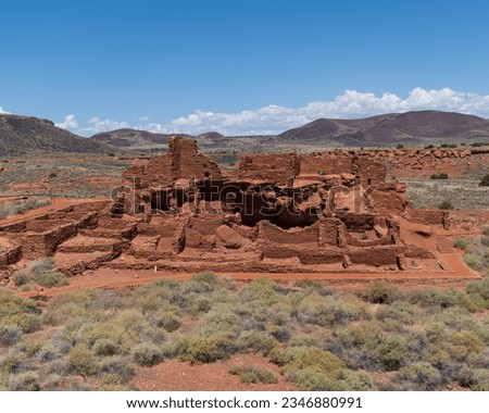 Wupatki National Monument in Arizona. Wupatki Pueblo, a multi-room pueblo built on natural rock outcrop by Ancient Pueblo People, (Cohonina, Kayenta, and Sinagua) from local red Moenkopi sandstone. Royalty-Free Stock Photo #2346880991