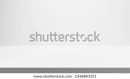 White stage background, white empty blank stage table with spotlight, place for products, cosmetics and design, white wall background and gray gradient backdrop with empty white floor.