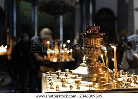 Burning candles in a church at a church service