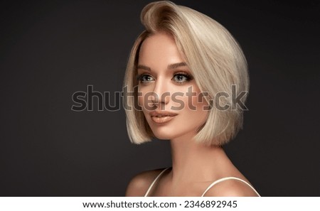 Beautiful model girl with short hair .Beauty  smiling blonde  woman with bob haircut .Fashion, cosmetics and makeup