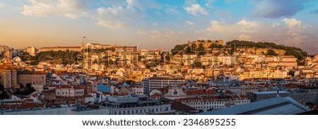 View of Lisbon city from Miradouro de Sao Pedro de Alcantara viewpoint on sunset. Lisbon, Portugal. Royalty-Free Stock Photo #2346895255