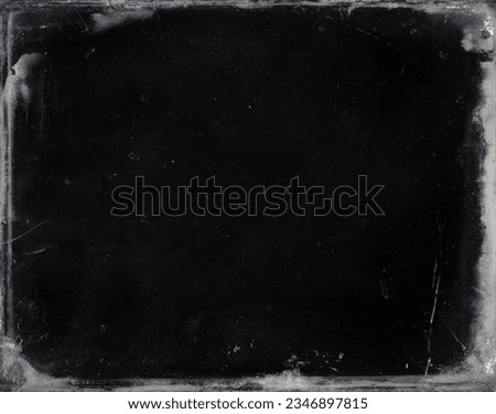 Enhance images with a vintage textured gray frame on black background. Wear, antiquity, paint cracks enrich its charm, adding authenticity and nostalgia. Royalty-Free Stock Photo #2346897815