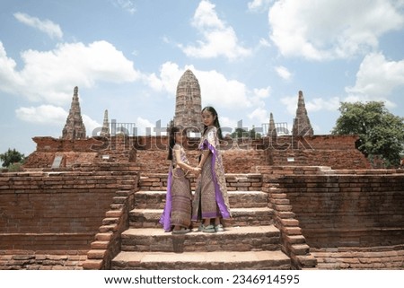  little girl  Thai traditional dress  with ancient ruin