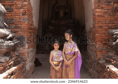  little girl  Thai traditional dress  with ancient ruin