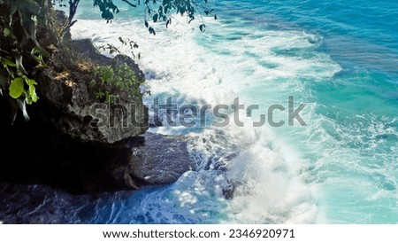 View of the waves crashing against the rocks at Liang Ayar Beach, Ambon, Maluku, Indonesia