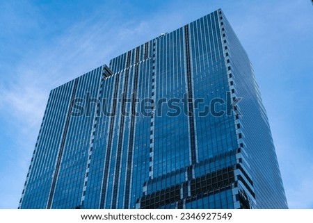skyscraper in metropolis city. city downtown with skyscraper. office building in business district. skyscraper building architecture. skyscraper with reflective glassy facade. modern glass building Royalty-Free Stock Photo #2346927549