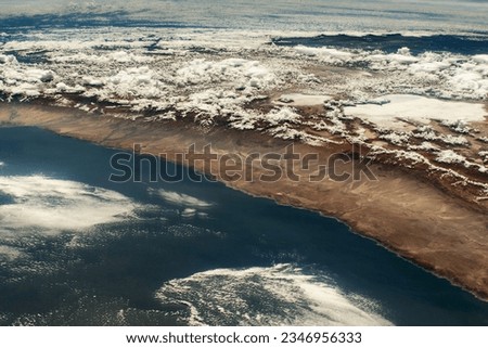 Look at this amazing picture of the Chilean Andes in South America. It was taken from a special camera on the International Space Station. These mountains are really high, with the tallest one called 