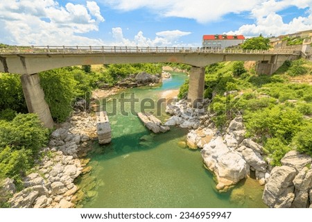 Mesi Bridge, historic stone structure in Albania. beckons visitors to marvel at its beauty, discover enchanting natural landscapes that surround it, and pay homage to its rich historical significance. Royalty-Free Stock Photo #2346959947