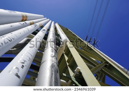 Pipeline on pipe rack in oil and gas project at construction site Royalty-Free Stock Photo #2346961039