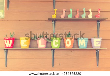 Welcome word on colorful vase - vintage effect style pictures