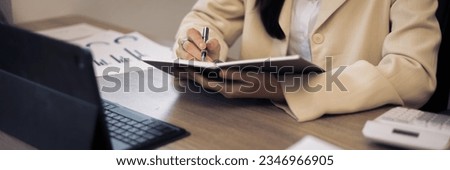 Creative woman typing on empty white screen tablet
