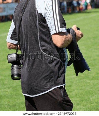 Sport photographer at the soccer match